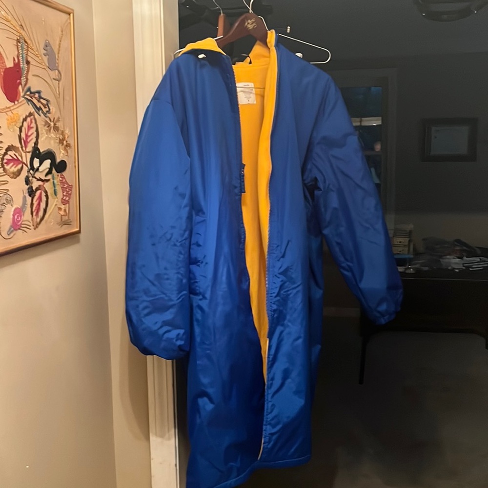 Almost brand new nylon lined coat to put over swim suits at meets